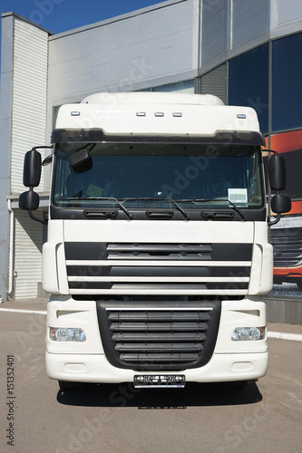 White trucks stand in line