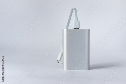Grey portable external battery ( power bank ) isolated on a white background