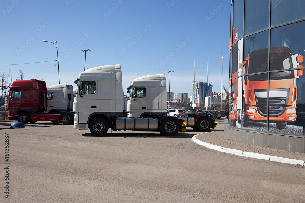 White trucks stand in line