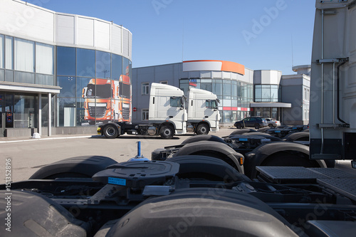 White trucks stand in line