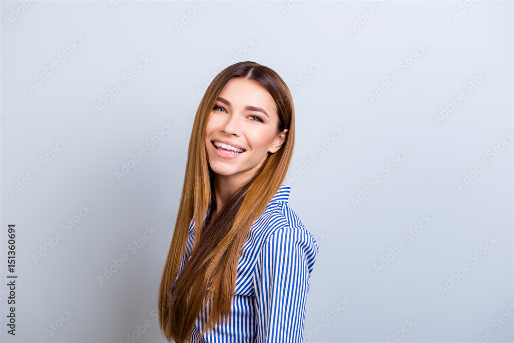 Portrait of beautiful smiling young business lady in formal wear standing on the pure background Portrait of beautiful smiling young business lady in formal wear standing on the pure background
