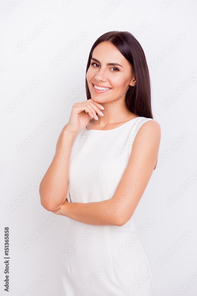 Portrait of slim cute girl in white strict outfit. She is successful and beautiful. Behind is a pure background Portrait of slim cute girl in white strict outfit. She is successful and beautiful. Behind is a pure background