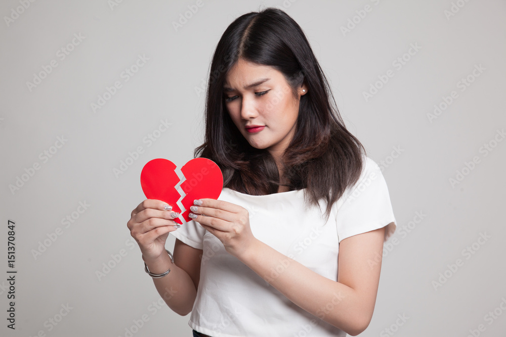 Beautiful young Asian woman with broken heart. Beautiful young Asian woman with broken heart.