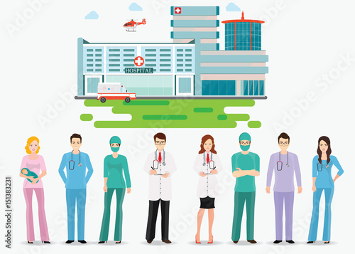 Medical staff standing in front of hospital building.