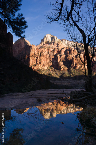 Water Filled Tarn Reflects High Mountains Zion National Park