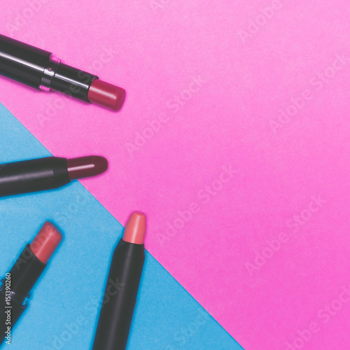 Lipsticks on colorful background. Makeup and Beauty concept