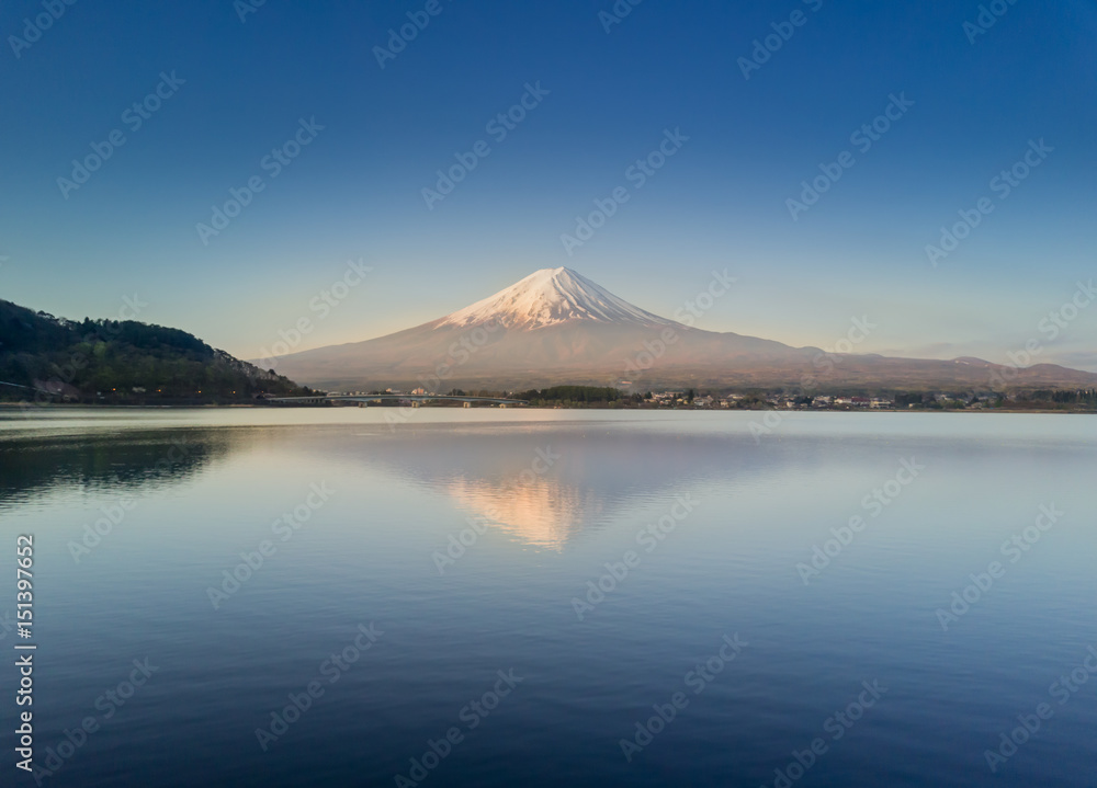 Mountain Fuji reflected in Kawaguchiko lake on a sunny day and clear sky Mountain Fuji reflected in Kawaguchiko lake on a sunny day and clear sky