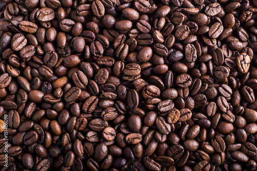 Coffee bean texture, background, copy plase. Place for text or inscription. Top view.