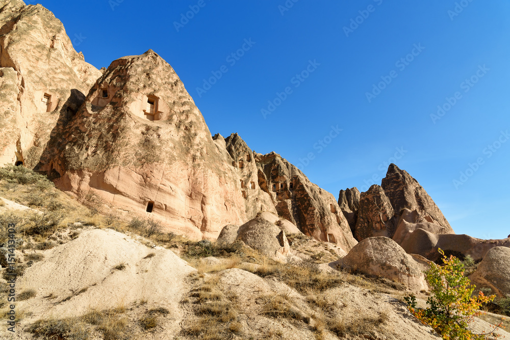 Fototapeta premium View of cave houses in valley at Cavusin. Cappadocia. Turkey