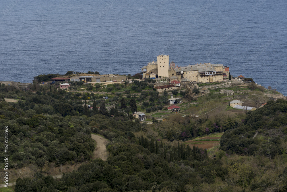 Distance view of a Monastery on The Holy Athos Mountain, Greece; seaside, spring time