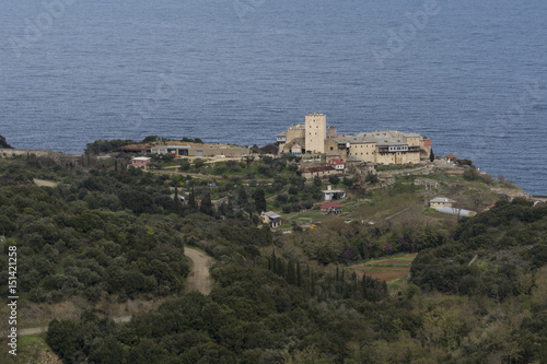 Distance view of a Monastery on The Holy Athos Mountain, Greece  seaside, spring time © Oana