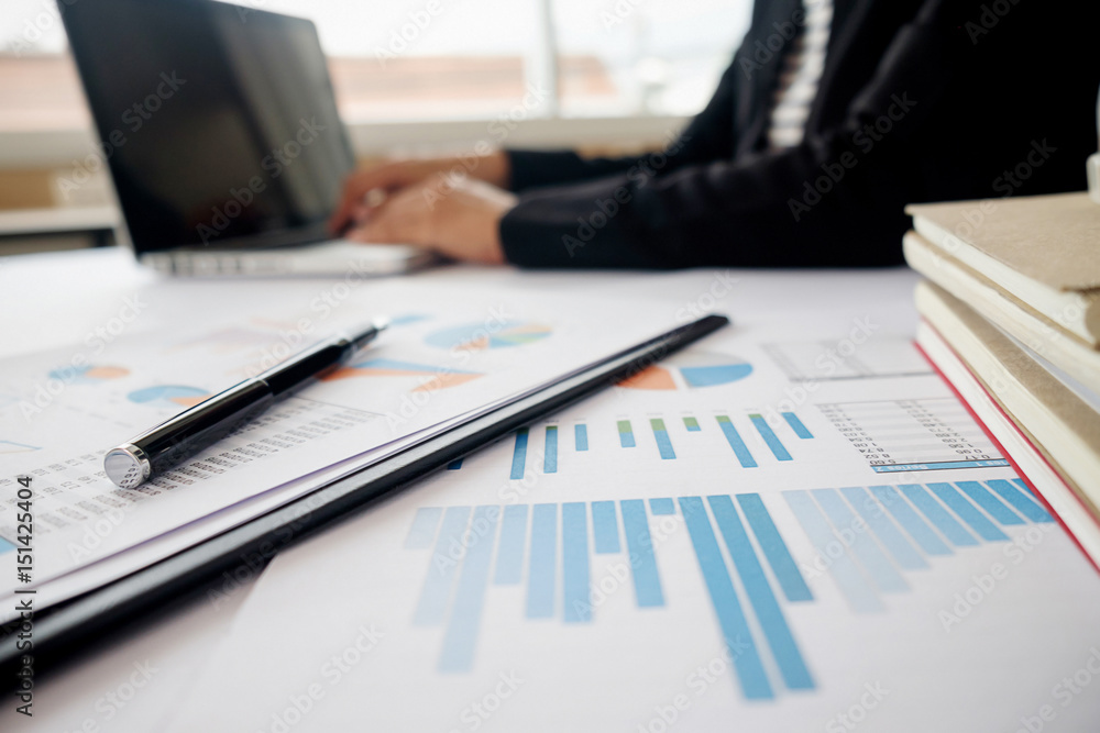 Business concept. Business people discussing the charts and graphs showing the results of their successful teamwork. Selective focus. Business concept. Business people discussing the charts and graphs showing the results of their successful teamwork. Selective focus.