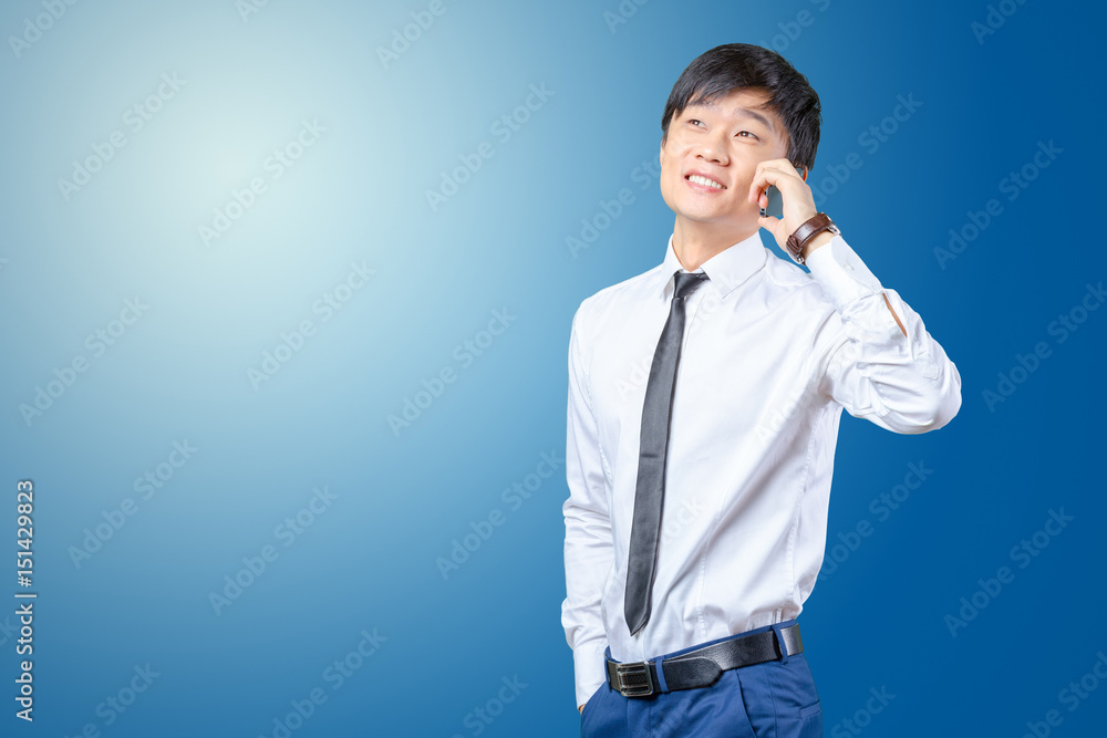 Asian businessman talking on mobile cell phone