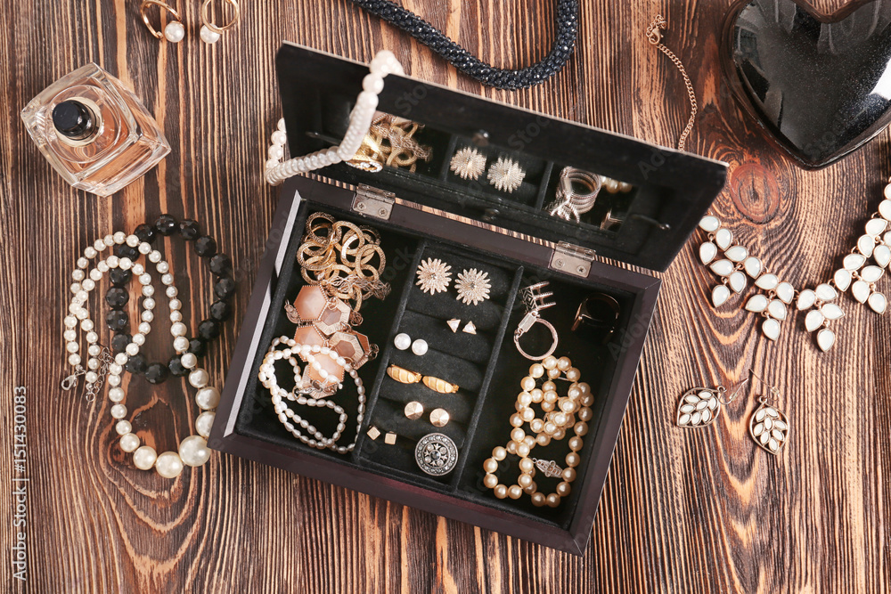 Jewelry accessories in box and table, top view Stock-Foto | Adobe Stock