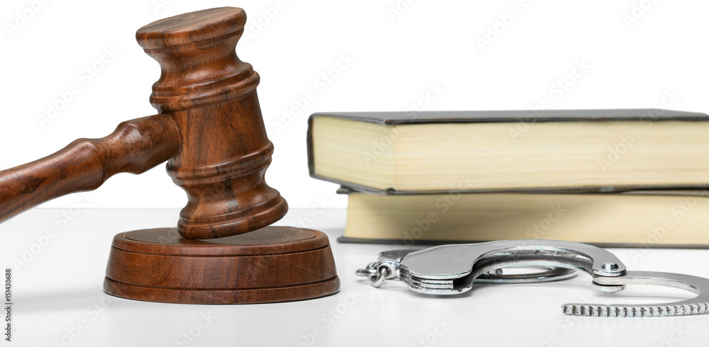 Gavel, books and handcuffs
