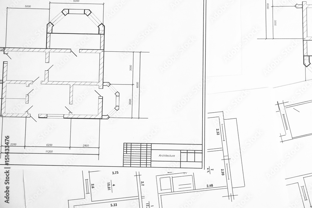 Engineering blueprints on table Engineering blueprints on table