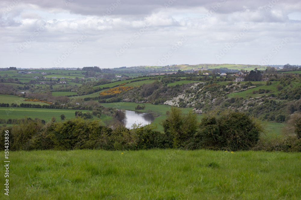 Springtime picture of the Irish countryside near Newgrange on a cloudy day.