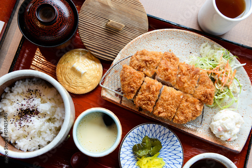 Original Japanese tonkatsu full set a Japanese dish which consists of a breaded, deep-fried pork cutlet. There are two main types, fillet and loin. It is often served with shredded cabbage.