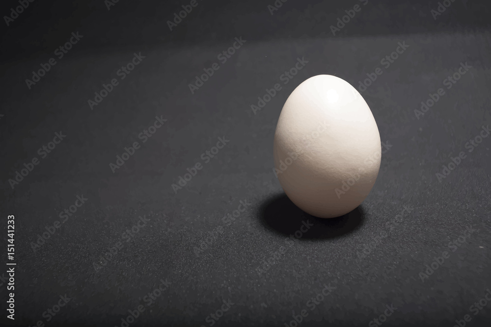 Egg standing on egg cup, isolated on white background Egg standing on egg cup, isolated on white background