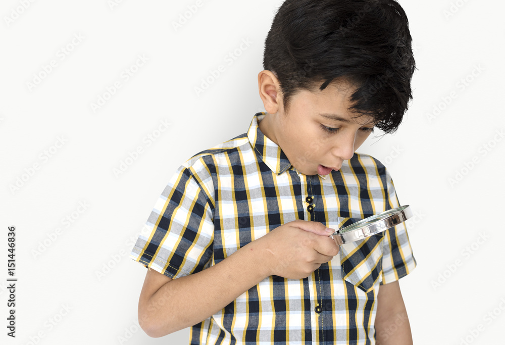 A boy hold magnifier in a shoot A boy hold magnifier in a shoot