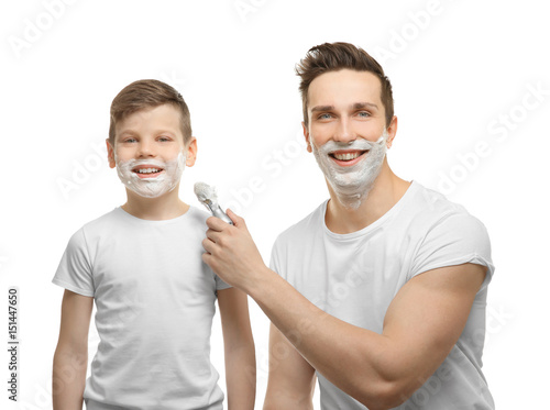 Father and son shaving on w...