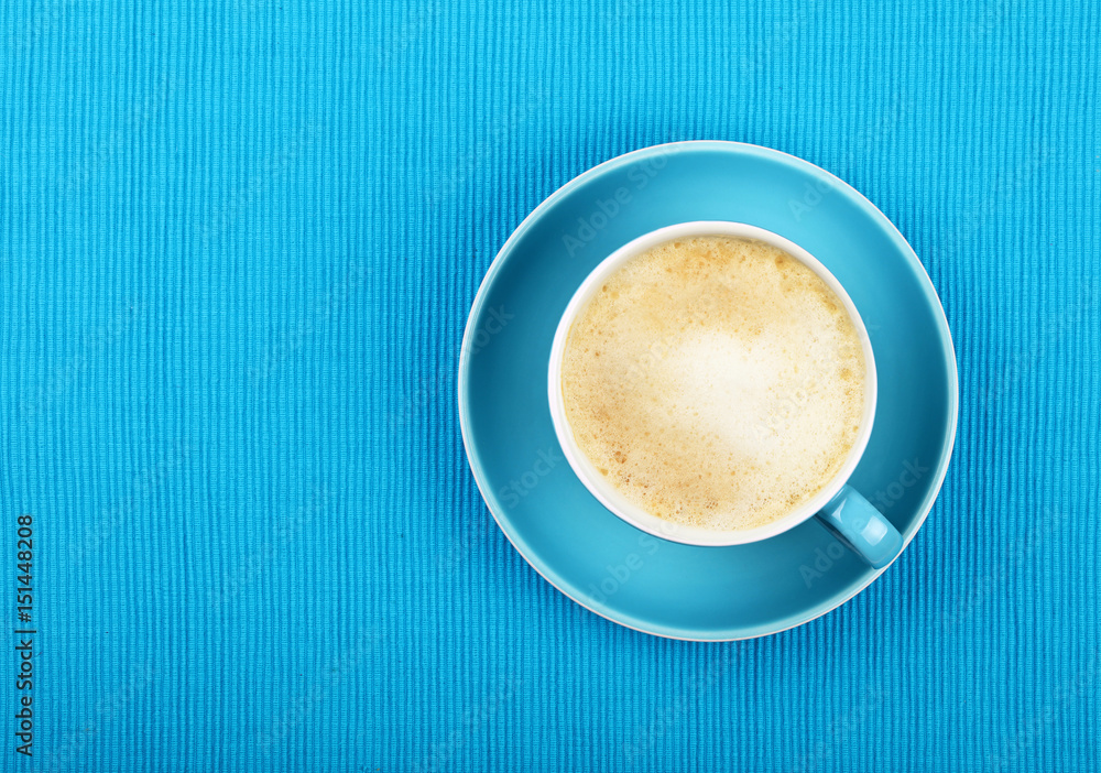 Full cappuccino latte coffee in blue cup top view Full cappuccino latte coffee in blue cup top view