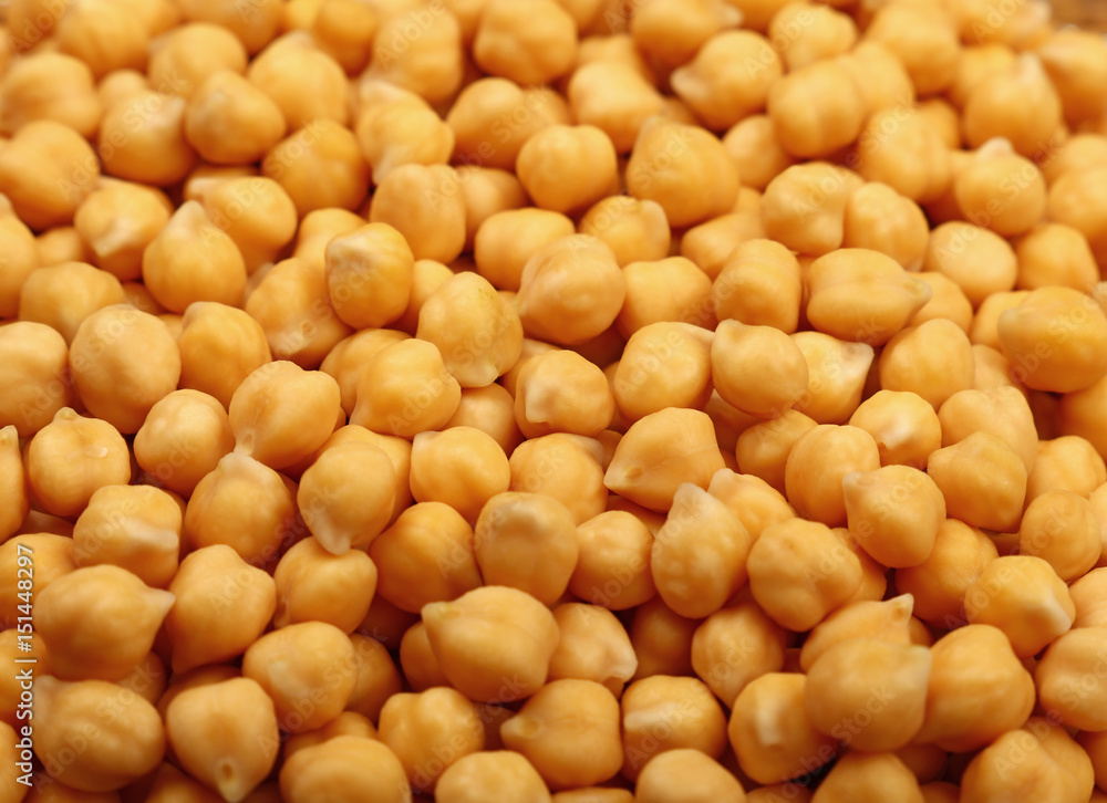 Cooked soaked chickpea beans close up background Cooked soaked chickpea beans close up background