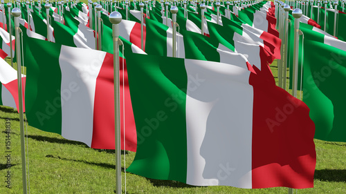 Flag of Italy in the Wind.
Waving flags of countries against the clear blue sky.  photo