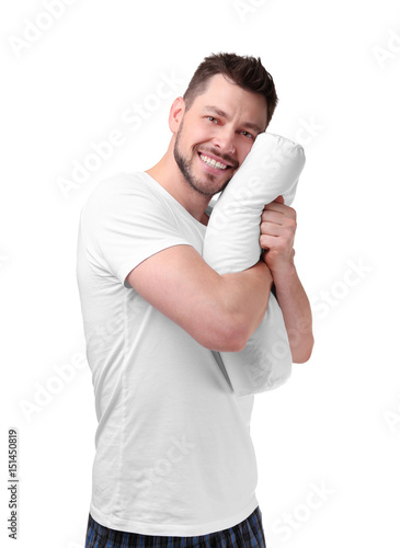 Young happy man in pajamas ...