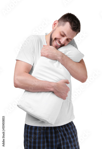 Young happy man in pajamas ...