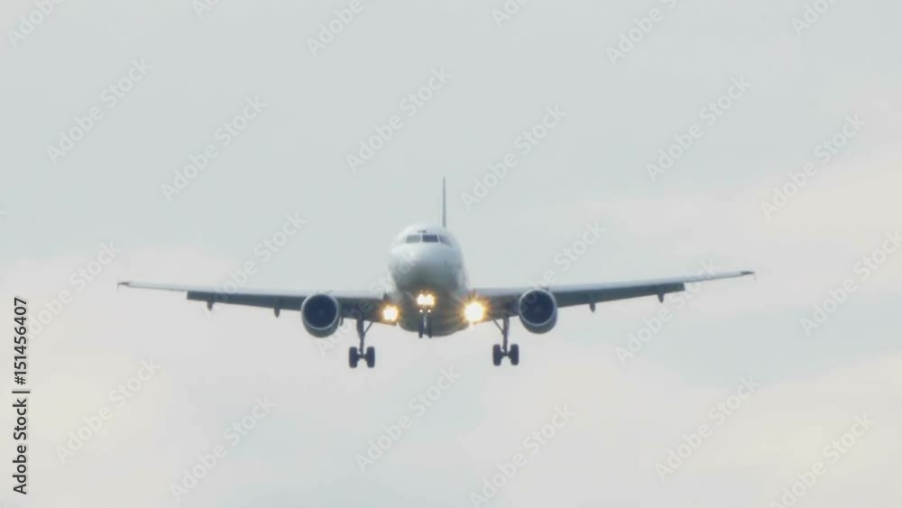 Plane Landing on Airport Track in a Cloudy Day Plane Landing on Airport Track in a Cloudy Day