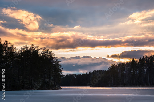Scenic landscape with dramatic sky and sunset at evening in Finland