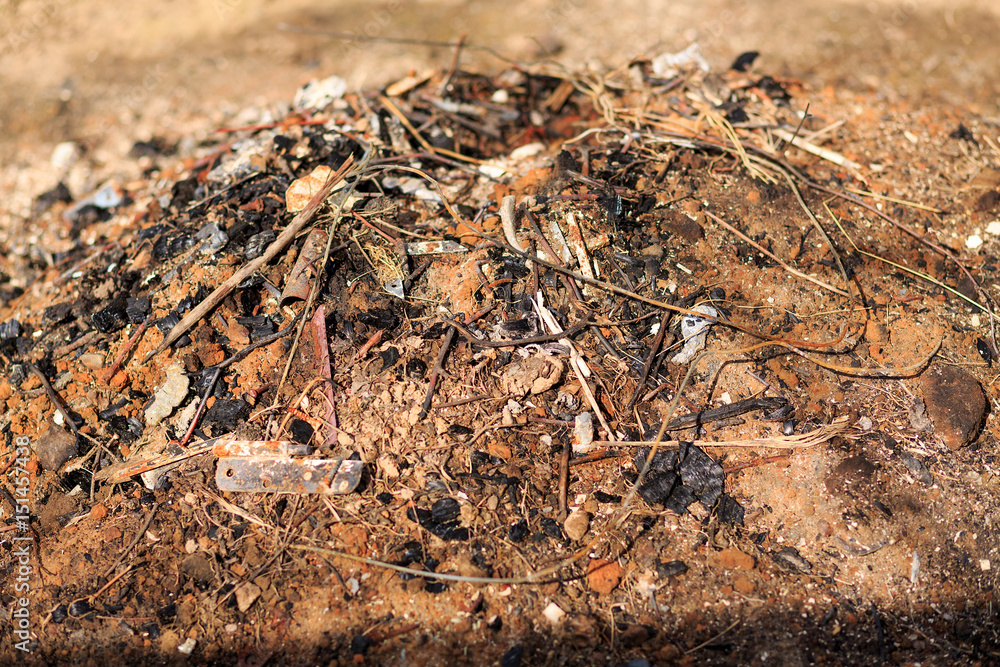 A lot of garbage with iron sticks and ashes A lot of garbage with iron sticks and ashes