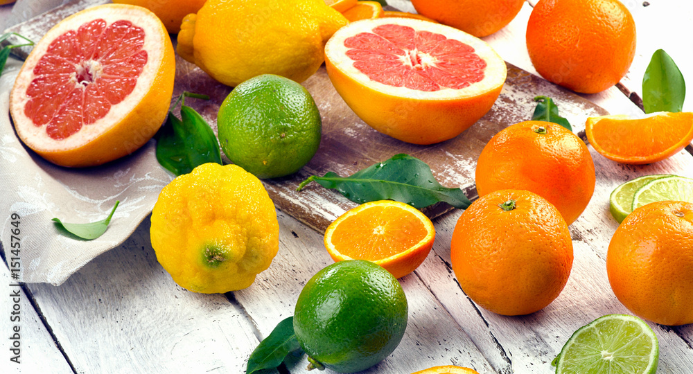 Fresh citrus fruits on wooden table Fresh citrus fruits on wooden table