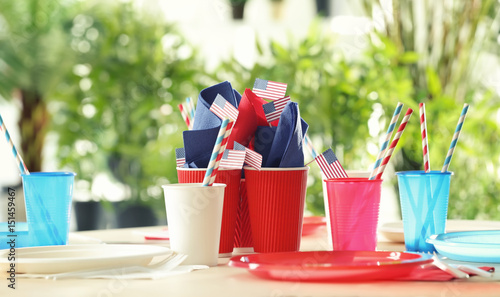 Table setting with plastic ware for summer picnic