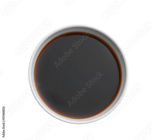 Bowl with tasty soy sauce on white background