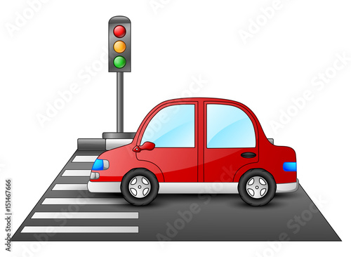 Red car and traffic lights on a pedestrian crossing 