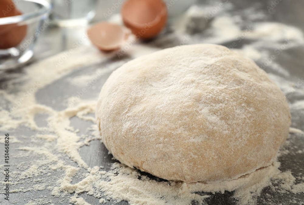 Raw dough on kitchen table, closeup