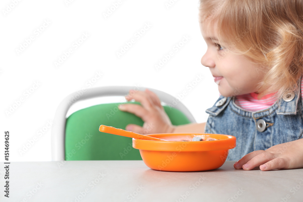 Cute little girl with yogurt and cornflakes on white background Cute little girl with yogurt and cornflakes on white background