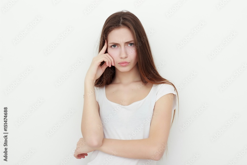 woman thinking and looking pensive in casual clothes woman thinking and looking pensive in casual clothes