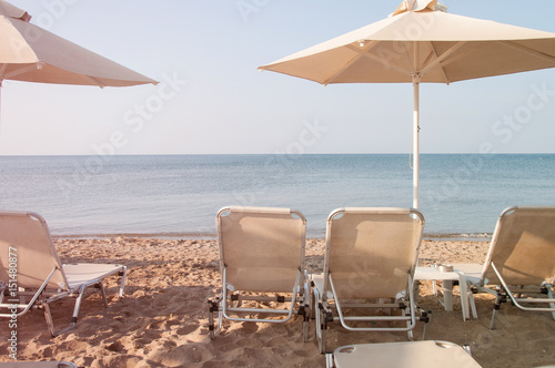 Lounge chairs and parasol on the beach