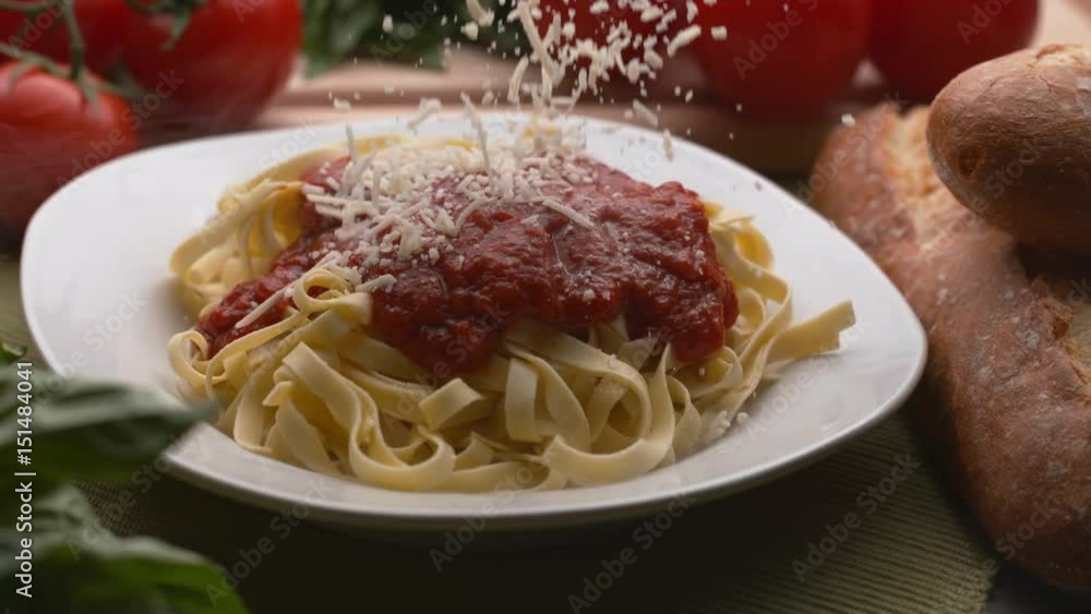 Parmesan cheese sprinkled onto pasta in super slow motion, shot on Phantom Flex Parmesan cheese sprinkled onto pasta in super slow motion, shot on Phantom Flex
