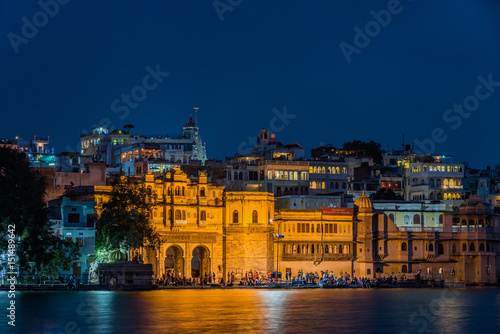 Udaipur's Gangaur Ghat on Lake Pichola at night. photo