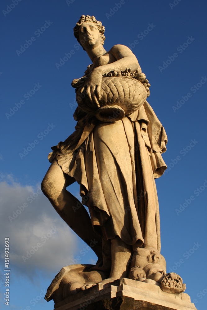statue on the bridge Ponte Santa Trinita in Florence, Italy