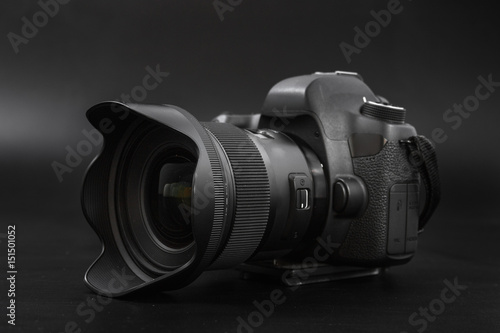 GOMEL, BELARUS - May 12, 2017: Canon 6d camera with lens on a black background. Canon is the world's largest SLR camera manufacturer. photo