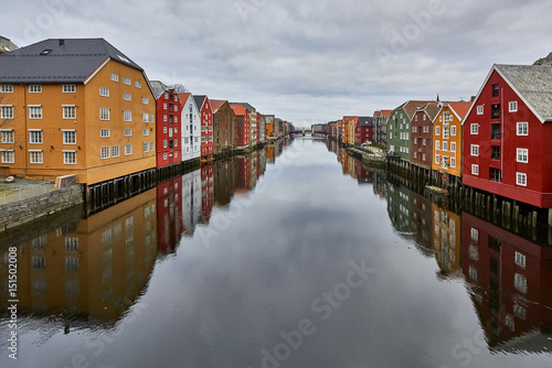 Colourful houses with reflection by the river in Trondheim, Norway