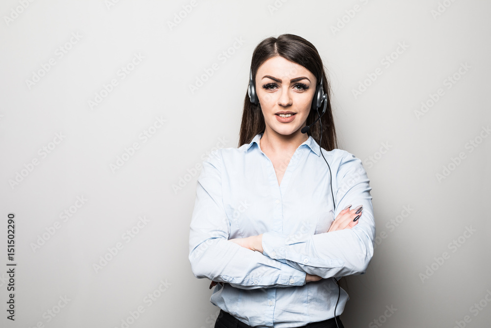 Portrait of smiling cheerful customer support phone operator in headset, with blank area for slogan, copyspace or product, against grey background Portrait of smiling cheerful customer support phone operator in headset, with blank area for slogan, copyspace or product, against grey background