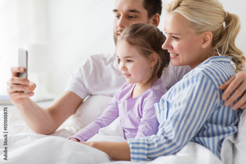 happy family taking selfie by smartphone at home happy family taking selfie by smartphone at home