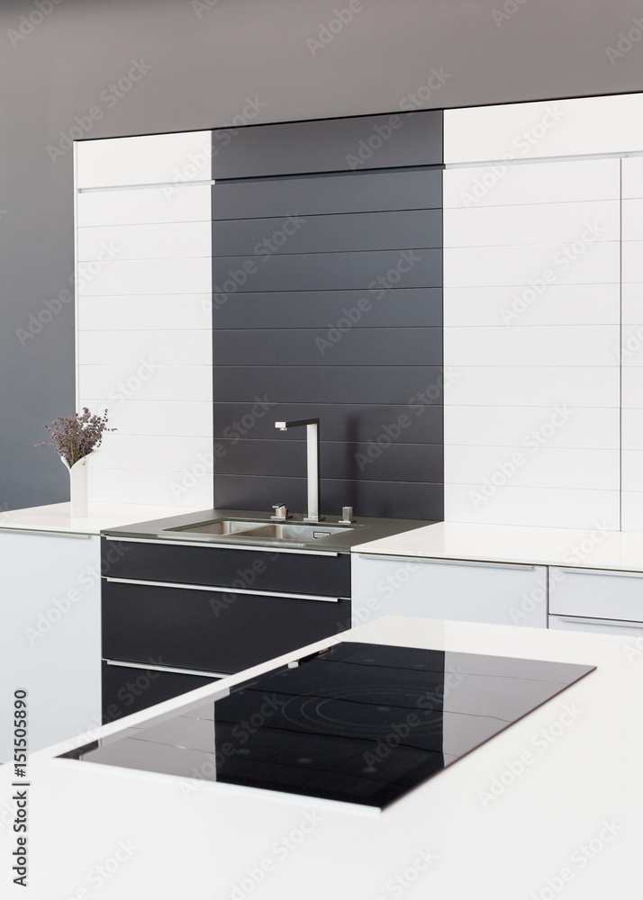 New modern black and white kitchen with chrome water tap and ...
