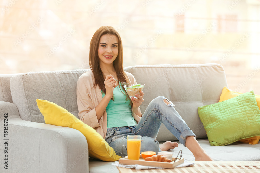 Beautiful young woman having breakfast at home Beautiful young woman having breakfast at home